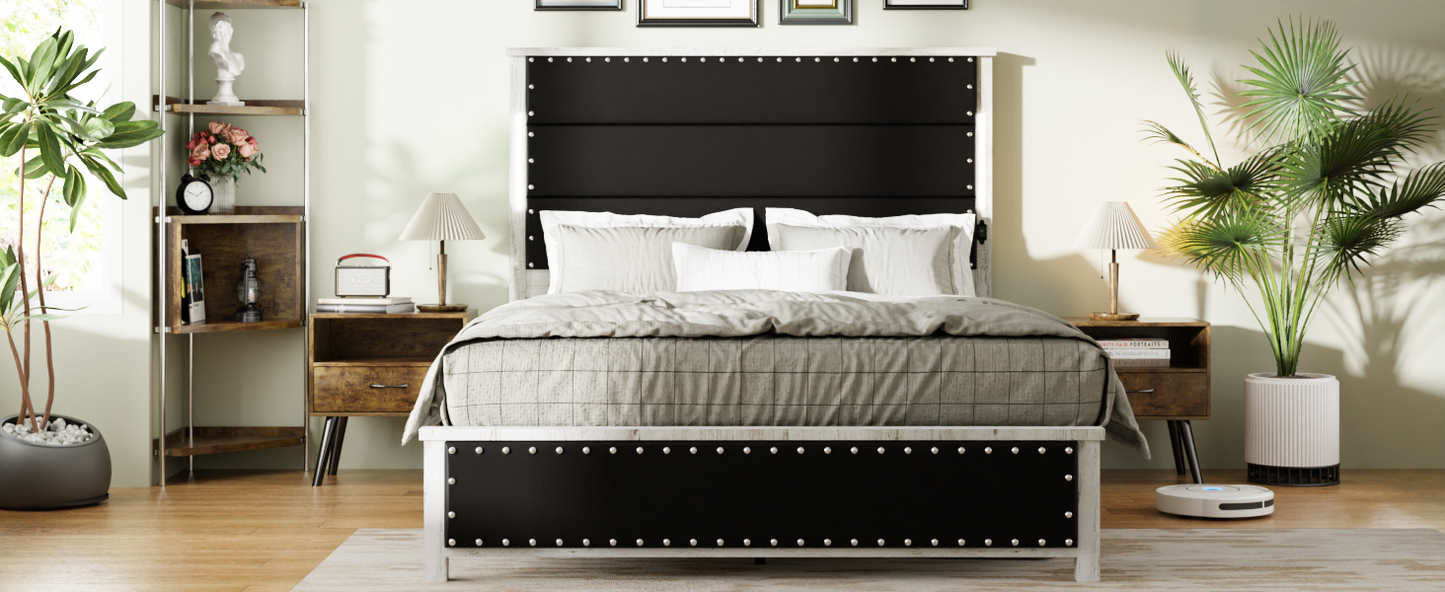 Black upholstered platform bed with silver nailhead trim