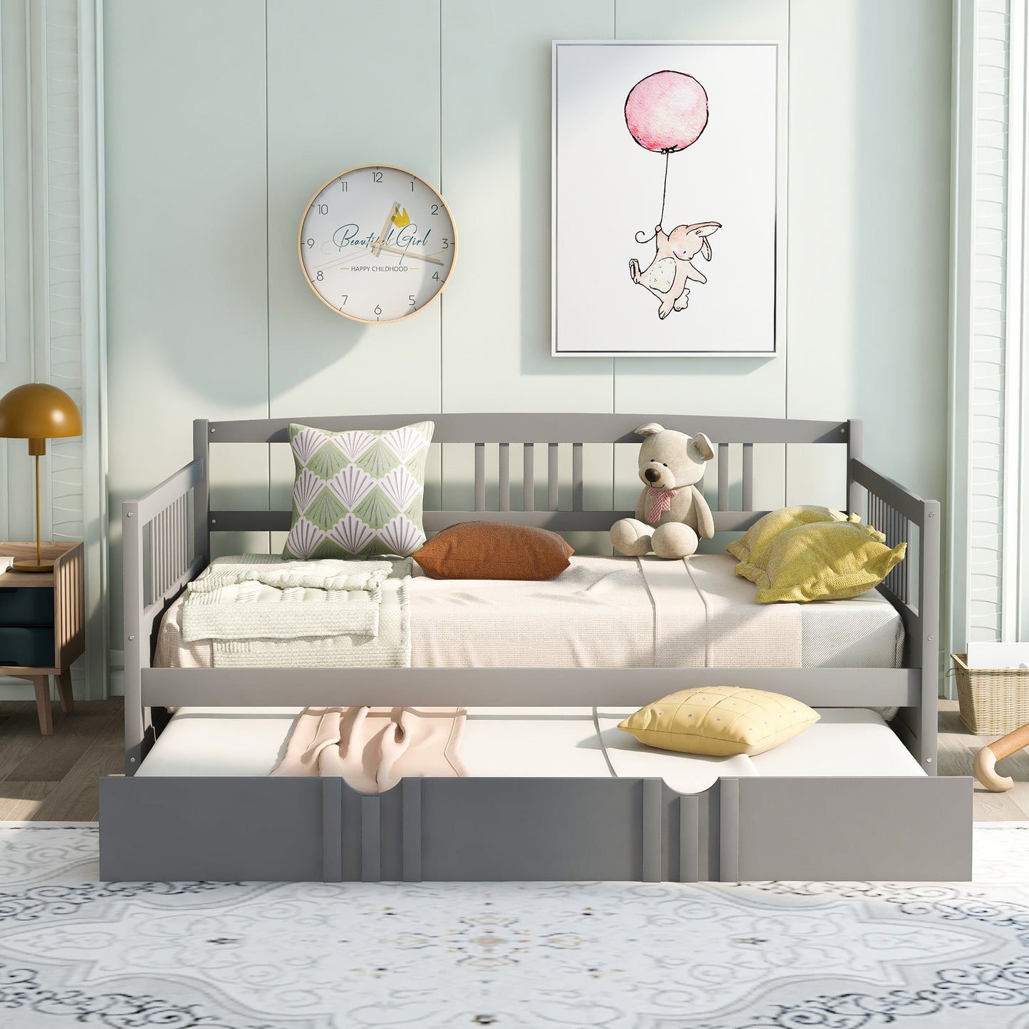 Gray wooden daybed with trundle plush bear and decorative pillows