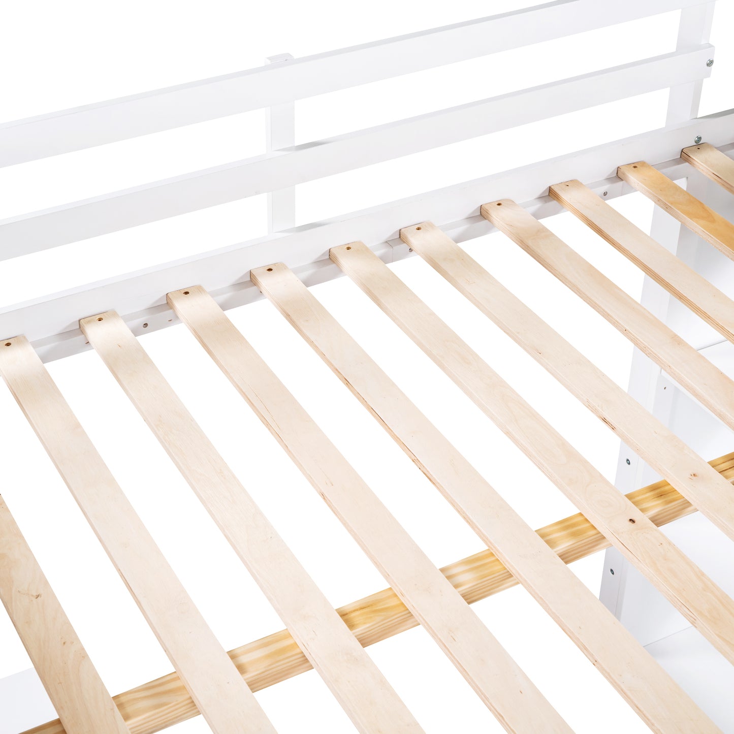 Closeup of a white wooden bed frame with a slatted base showcasing its sturdy construction