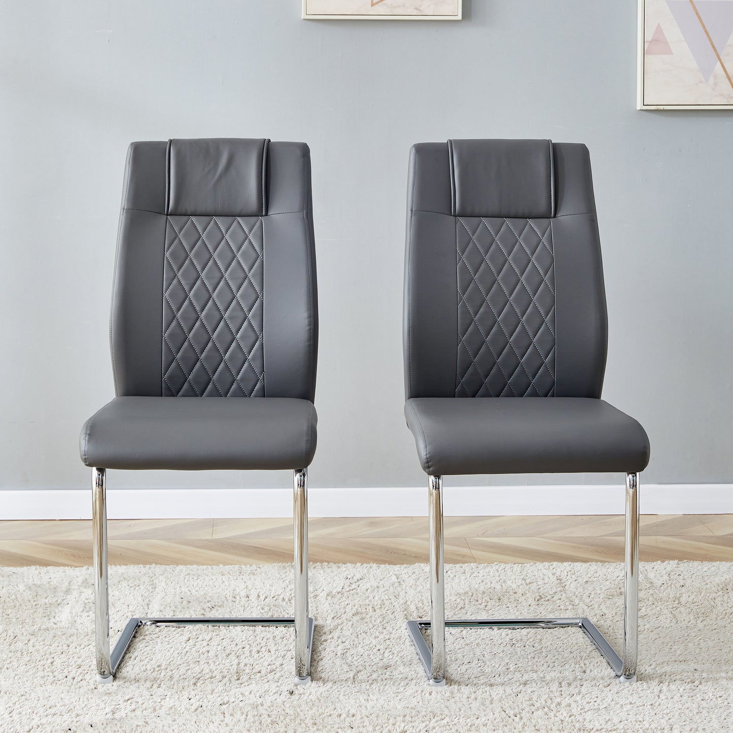 Grey faux leather dining chairs with diamond stitching