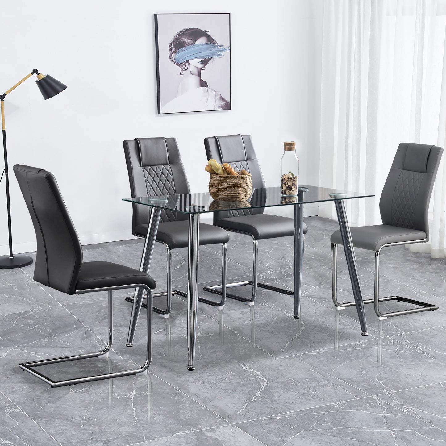 Modern glass dining table with four grey faux leather chairs