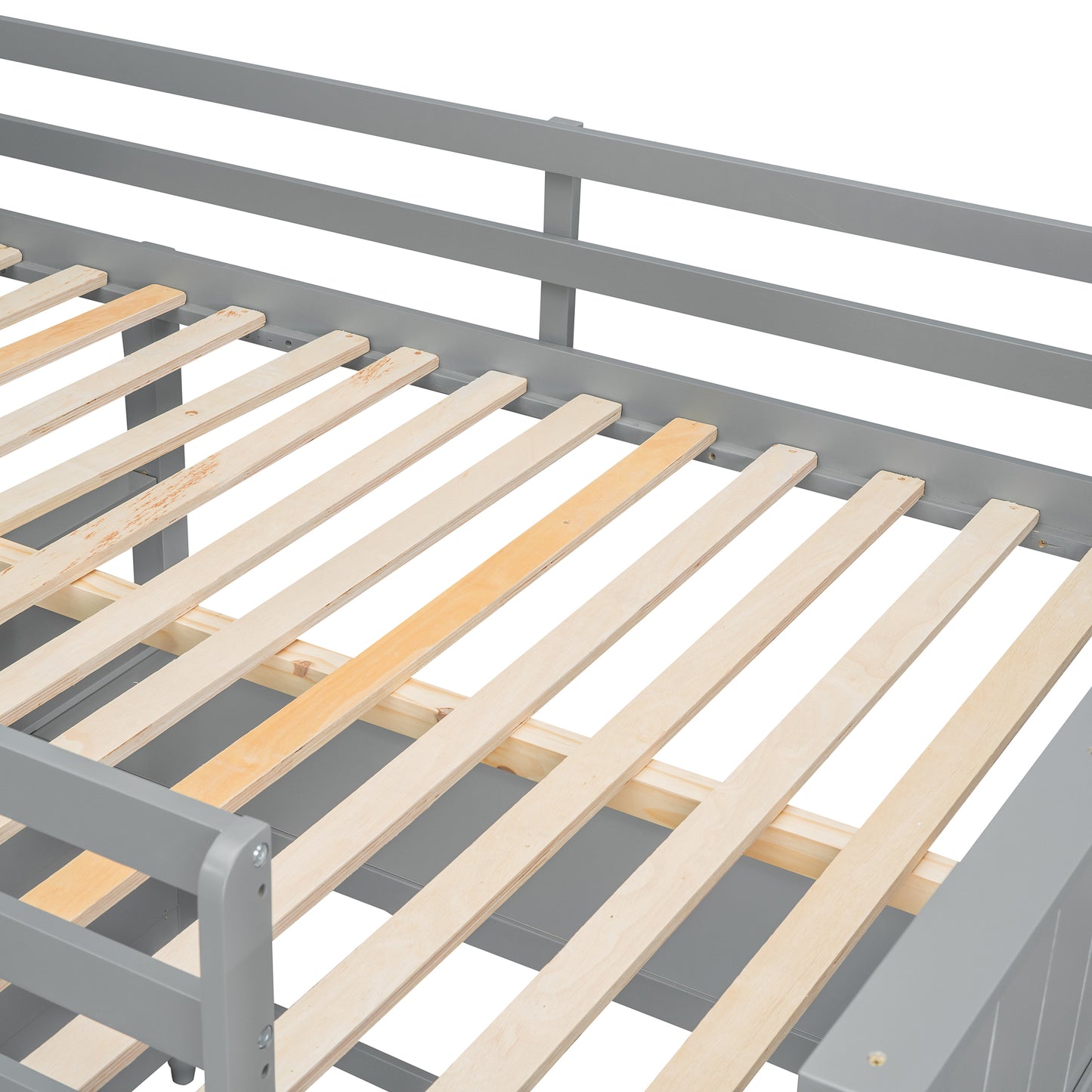 Closeup of a gray wooden daybed frame with natural wood slats for mattress support