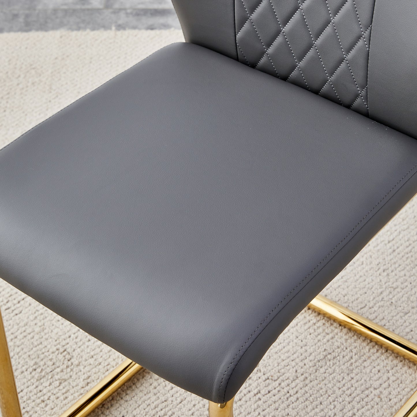 Gray faux leather bar stool seat with diamond stitching