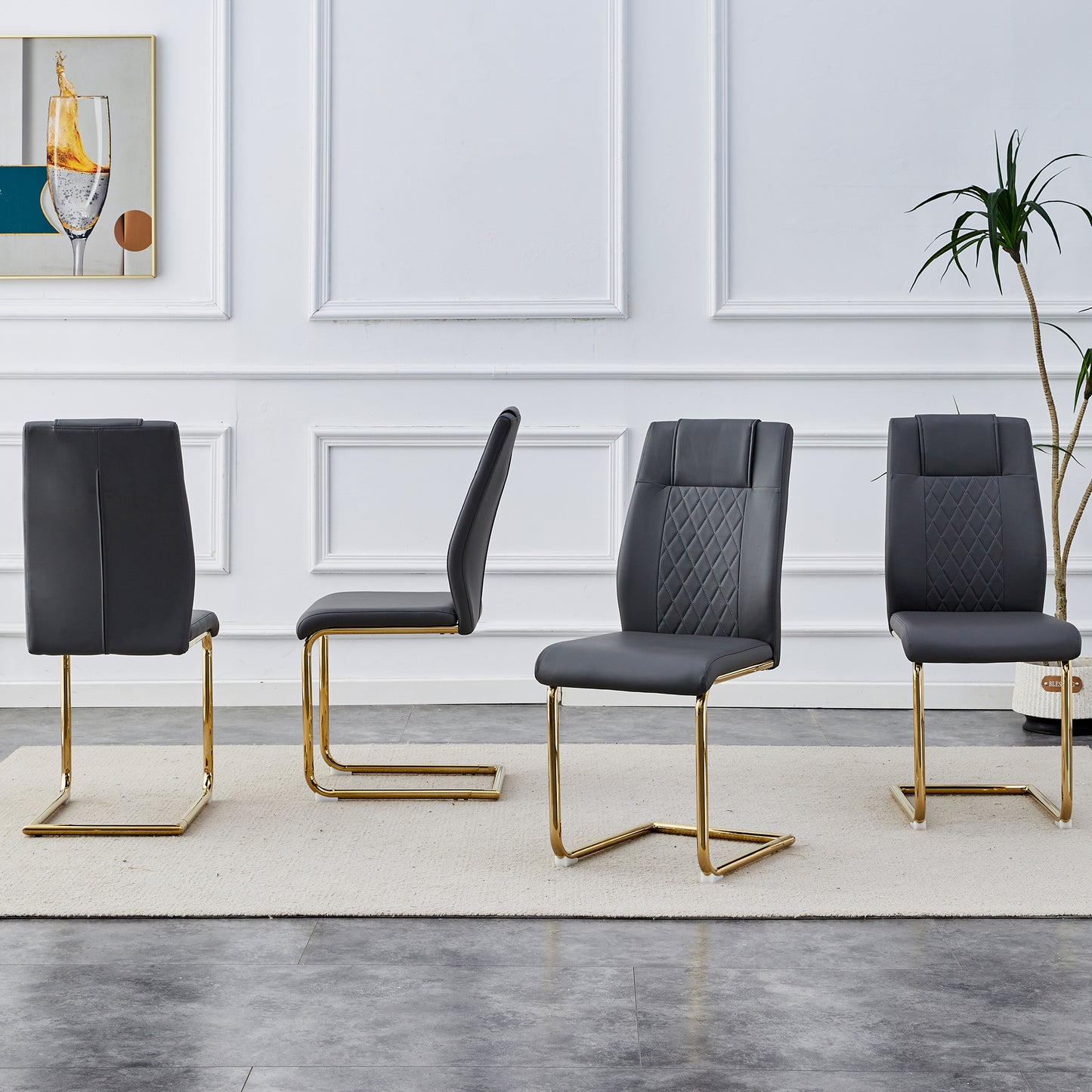 Dark gray faux leather dining chair with diamond stitching and gold sled legs
