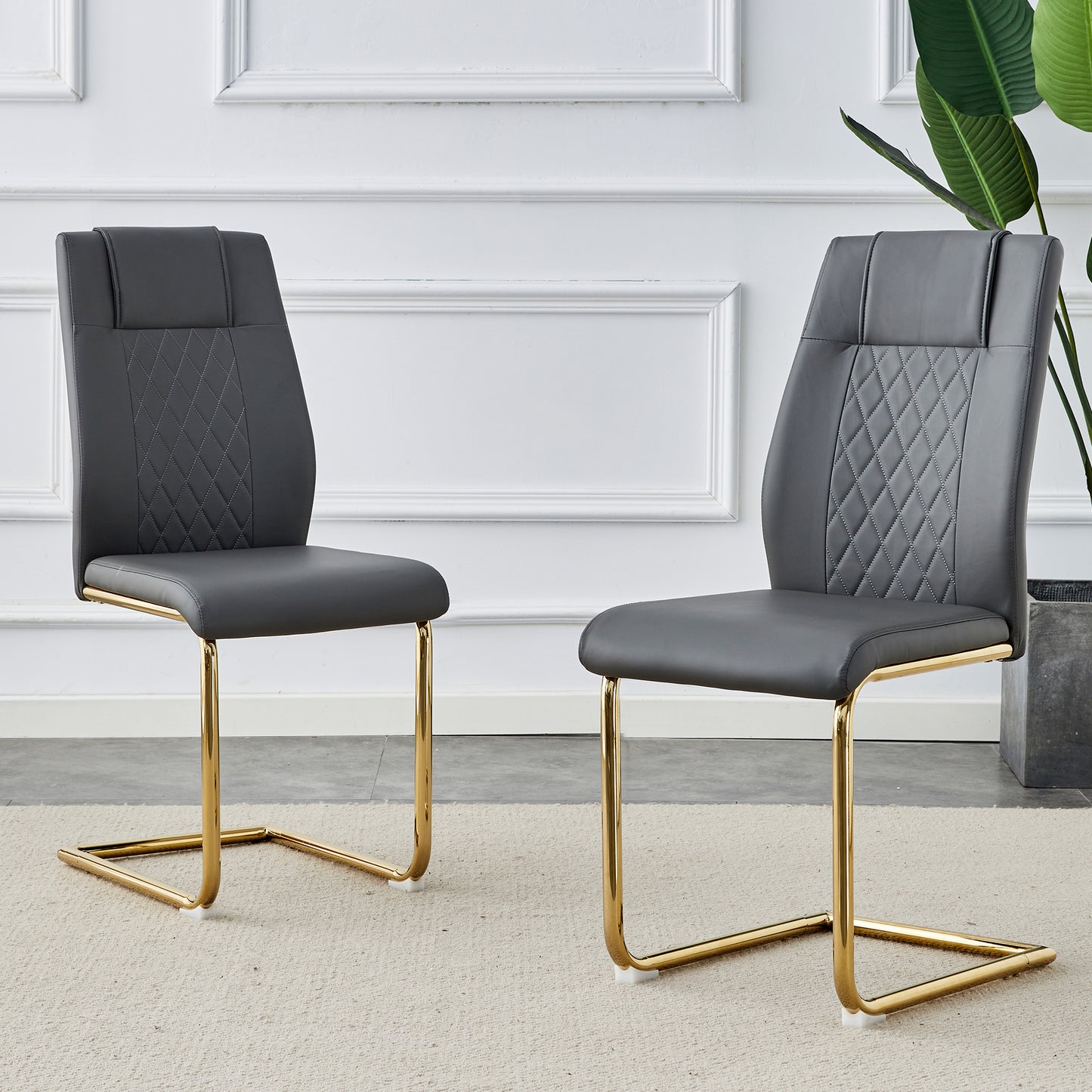 Modern dark gray faux leather dining chair with gold sled legs