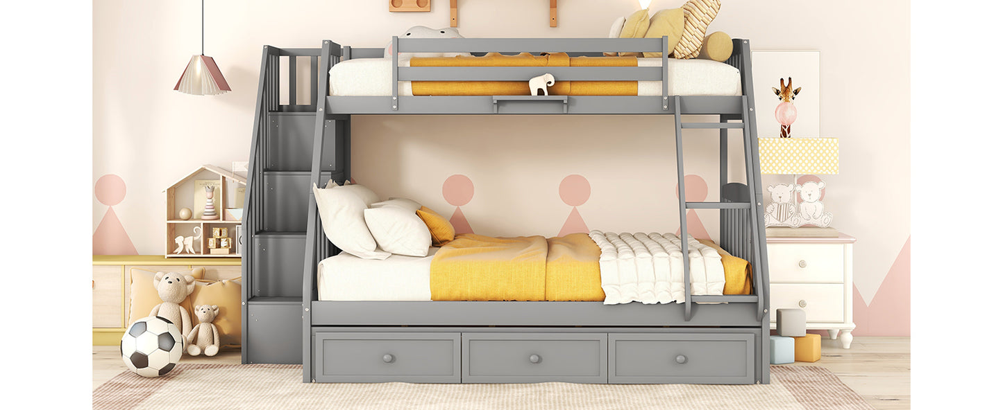 Gray wooden triple bunk bed with storage drawers and side stairs