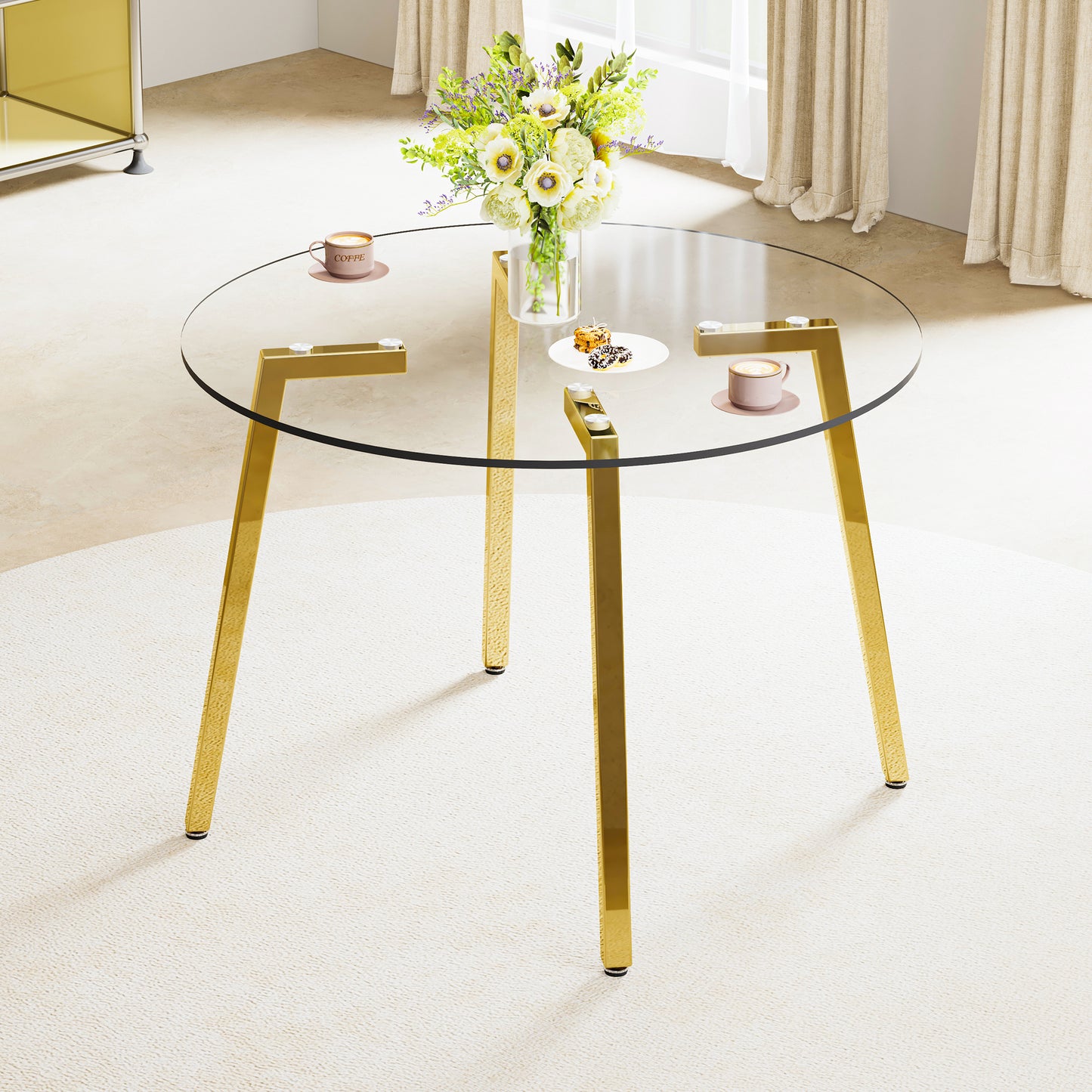 Round glass coffee table with gold metal legs