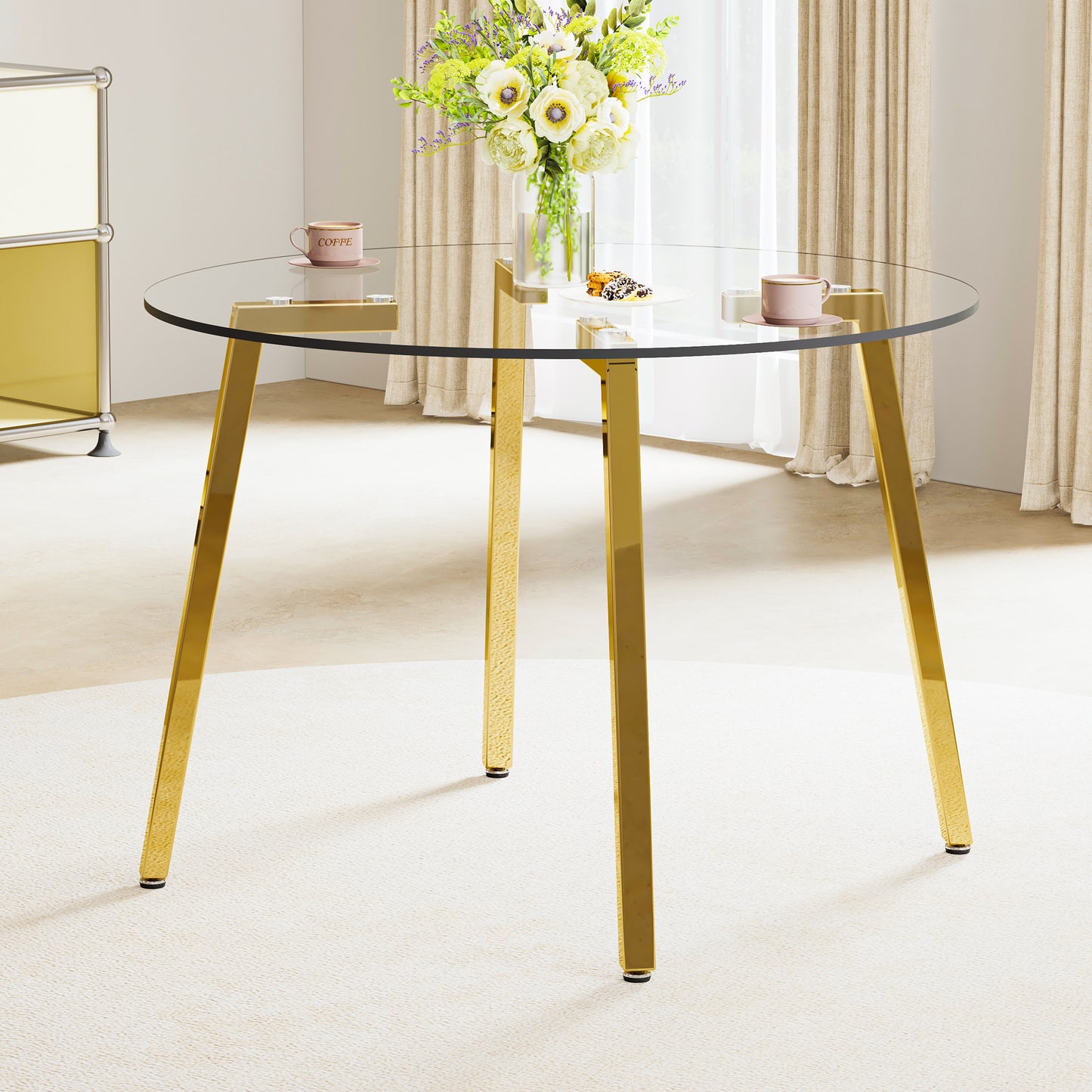 Round glass dining table with polished gold legs