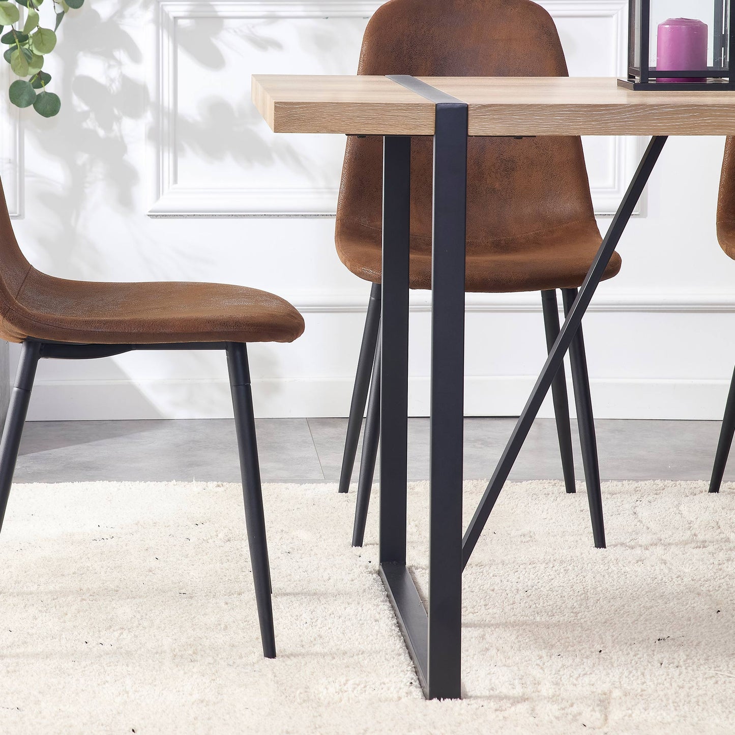 Modern brown faux leather dining chair with black metal legs