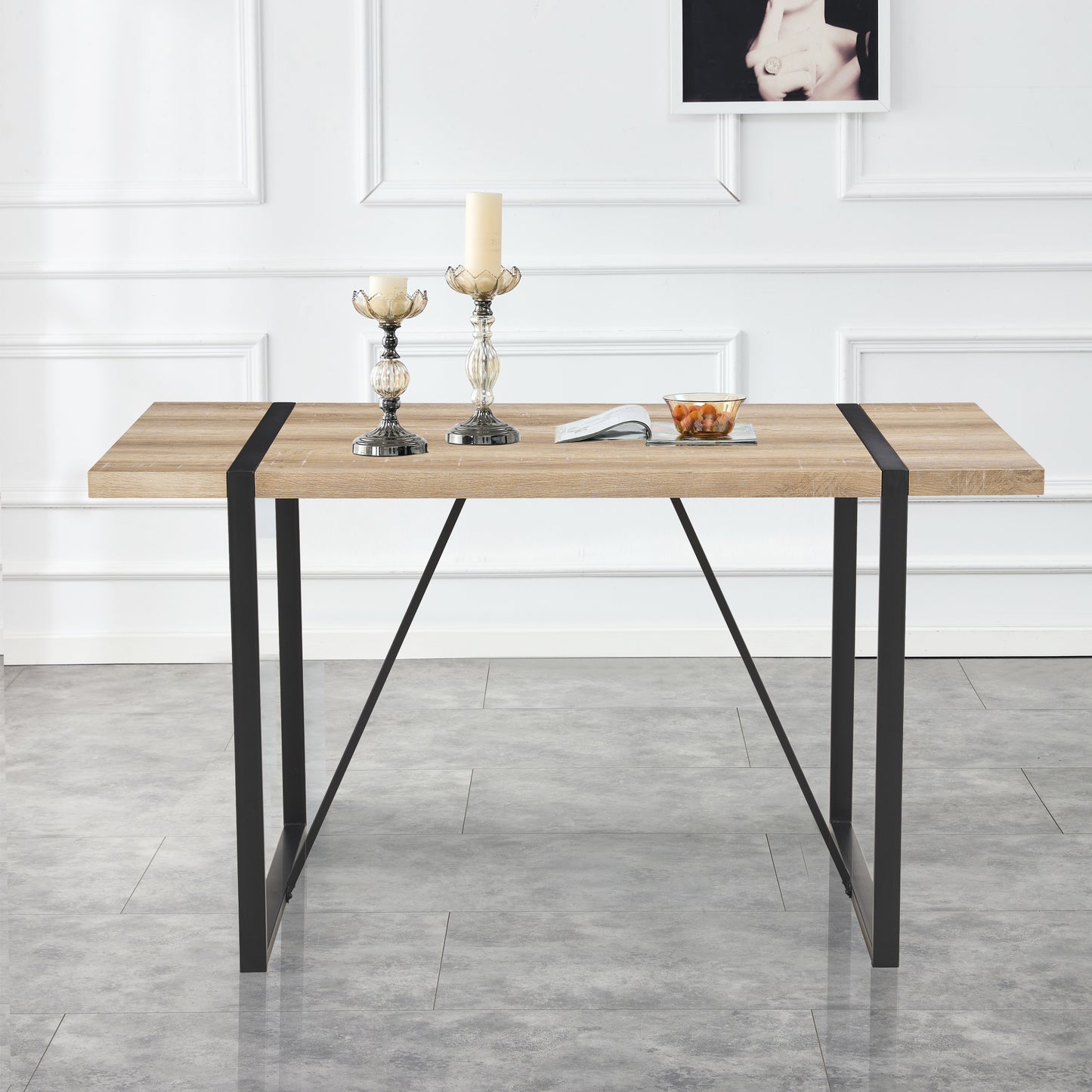 Modern oak dining table with black metal legs and inlaid detail