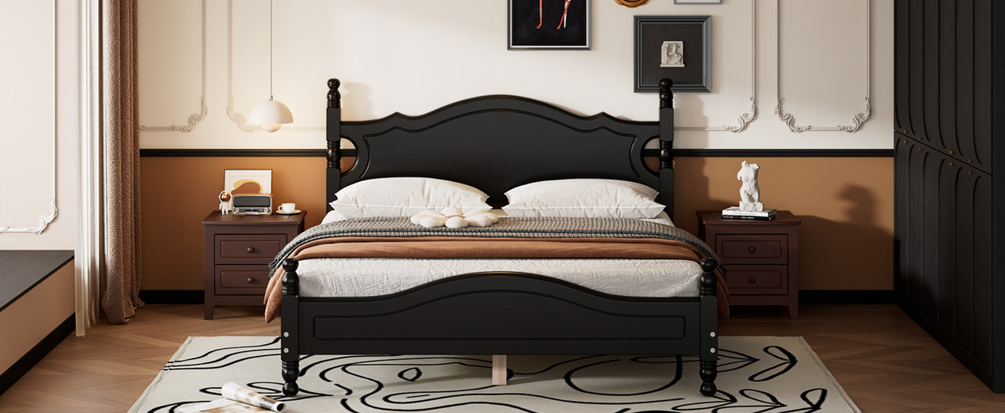 Elegant black wooden fourposter bed with ornate headboard featuring white bedding