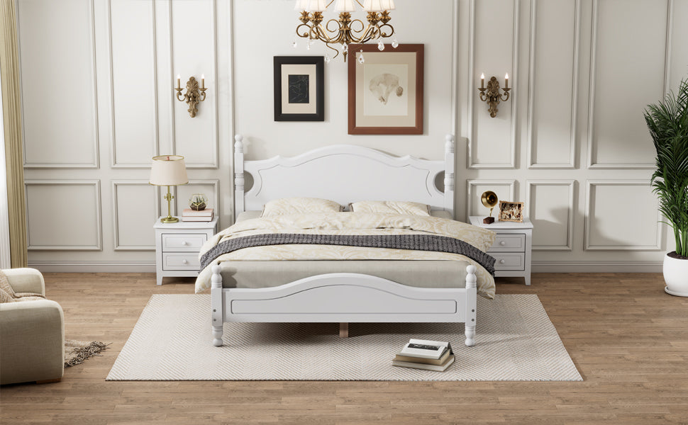 Elegant white wooden bed frame with ornate headboard and footboard set in a bedroom