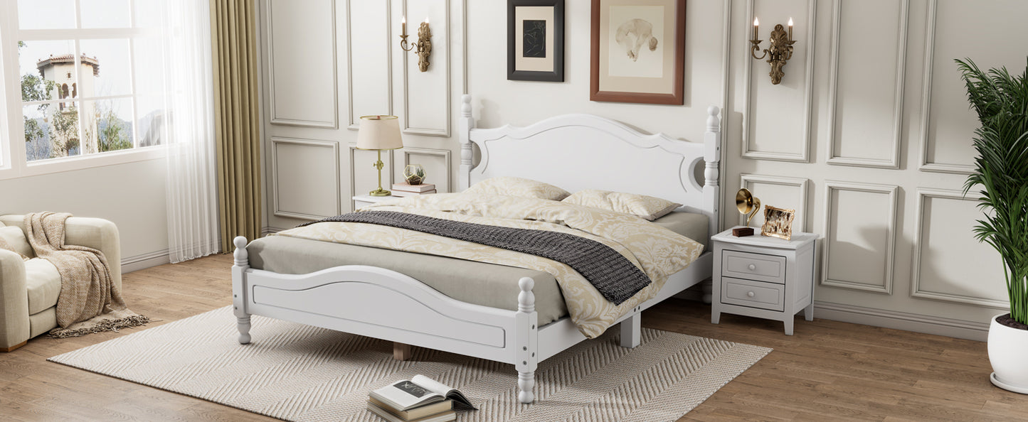 Elegant white wood frame bed with decorative headboard and footboard perfect for a classic bedroom