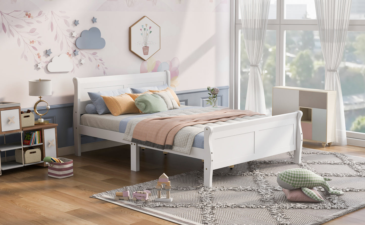 White sleigh bed frame with blue and orange pillows ideal for a childs bedroom