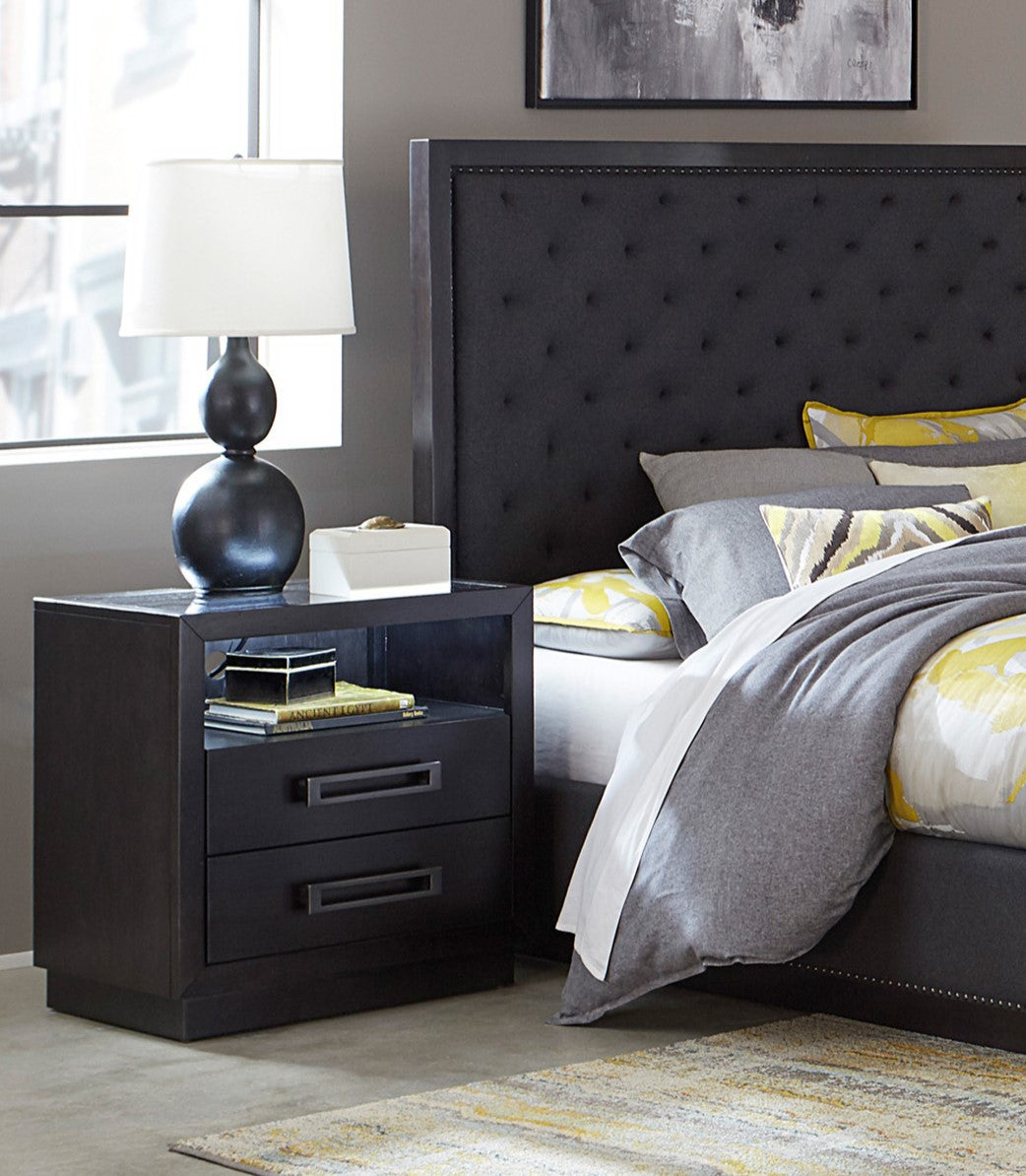 Dark gray tufted queen headboard with silver nailhead trim