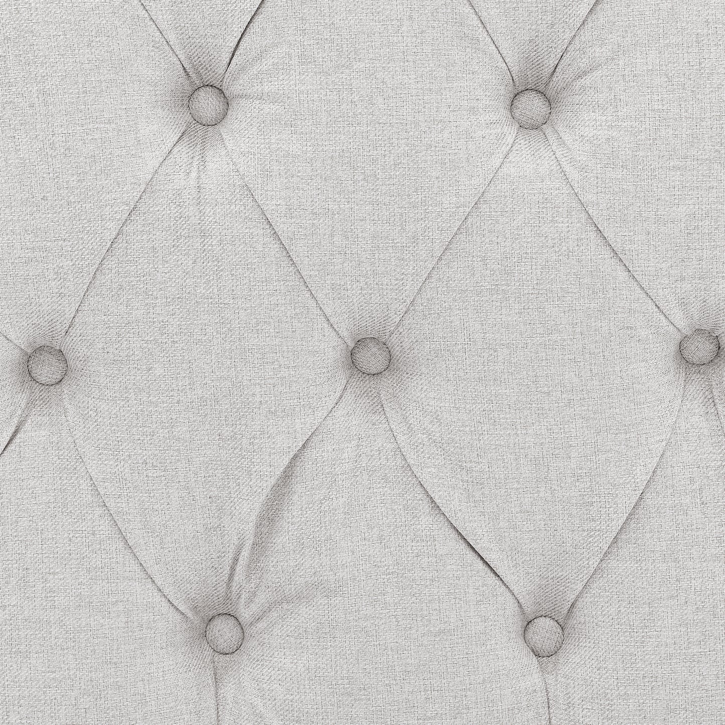 Closeup of light grey linen fabric with diamond tufting perfect for upholstery
