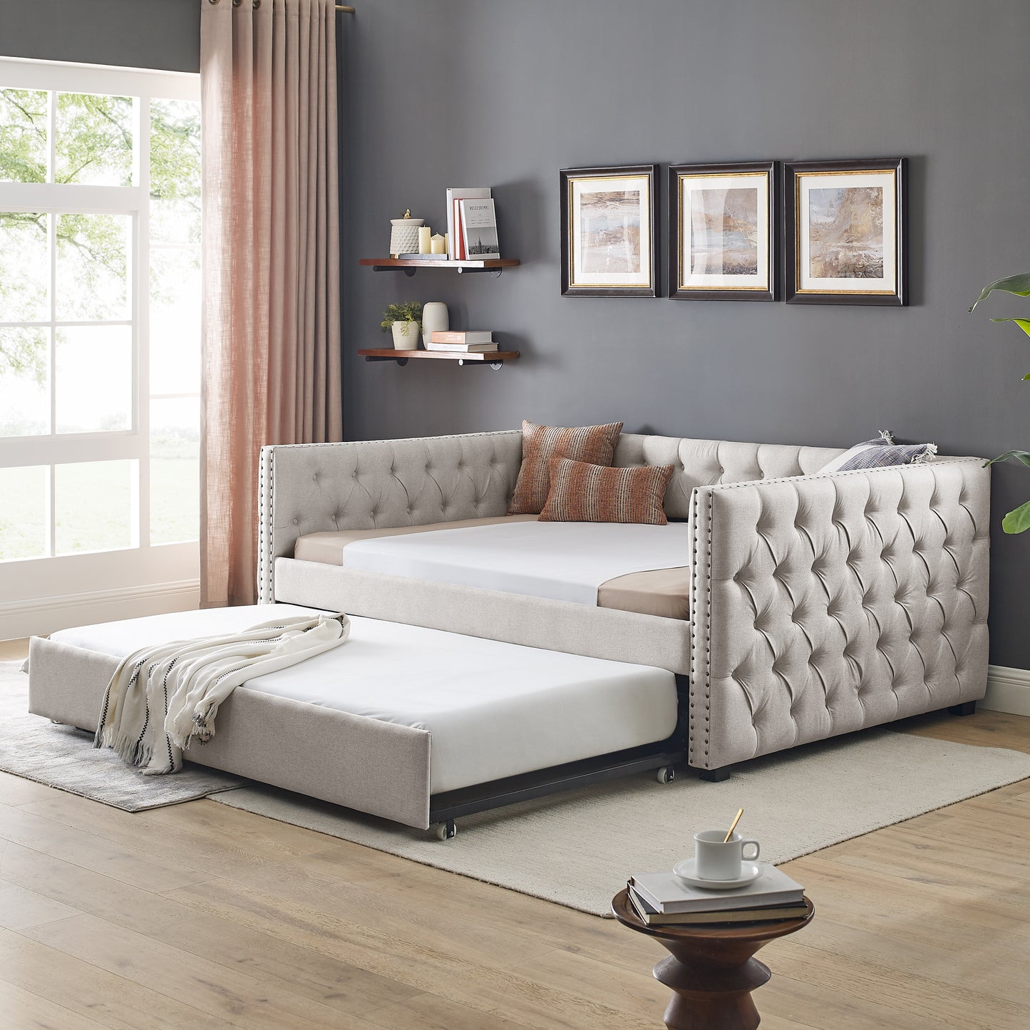 Tufted beige fabric daybed with pullout trundle for guest sleeping