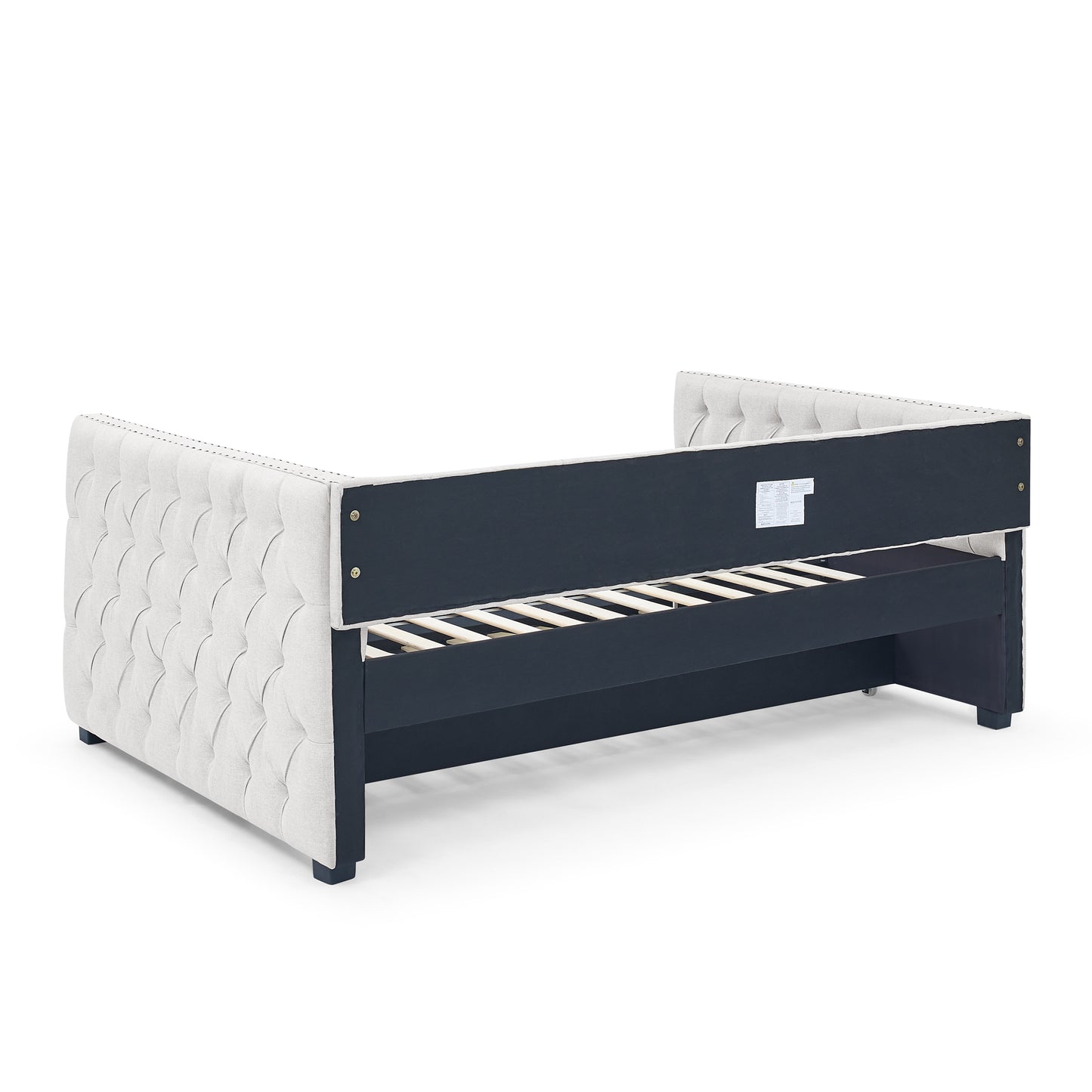 Tufted beige fabric daybed with dark wood frame and slatted base