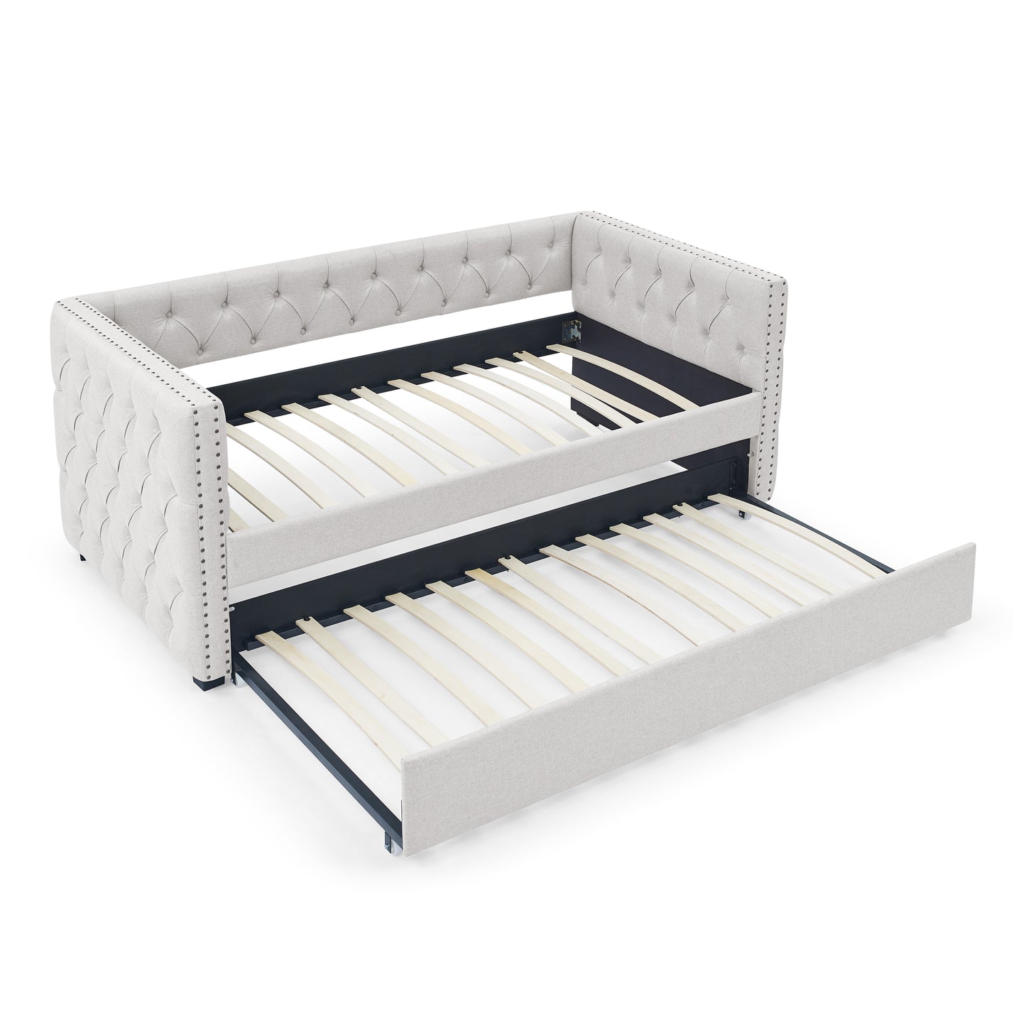 Tufted light gray fabric daybed with pullout trundle and nailhead trim