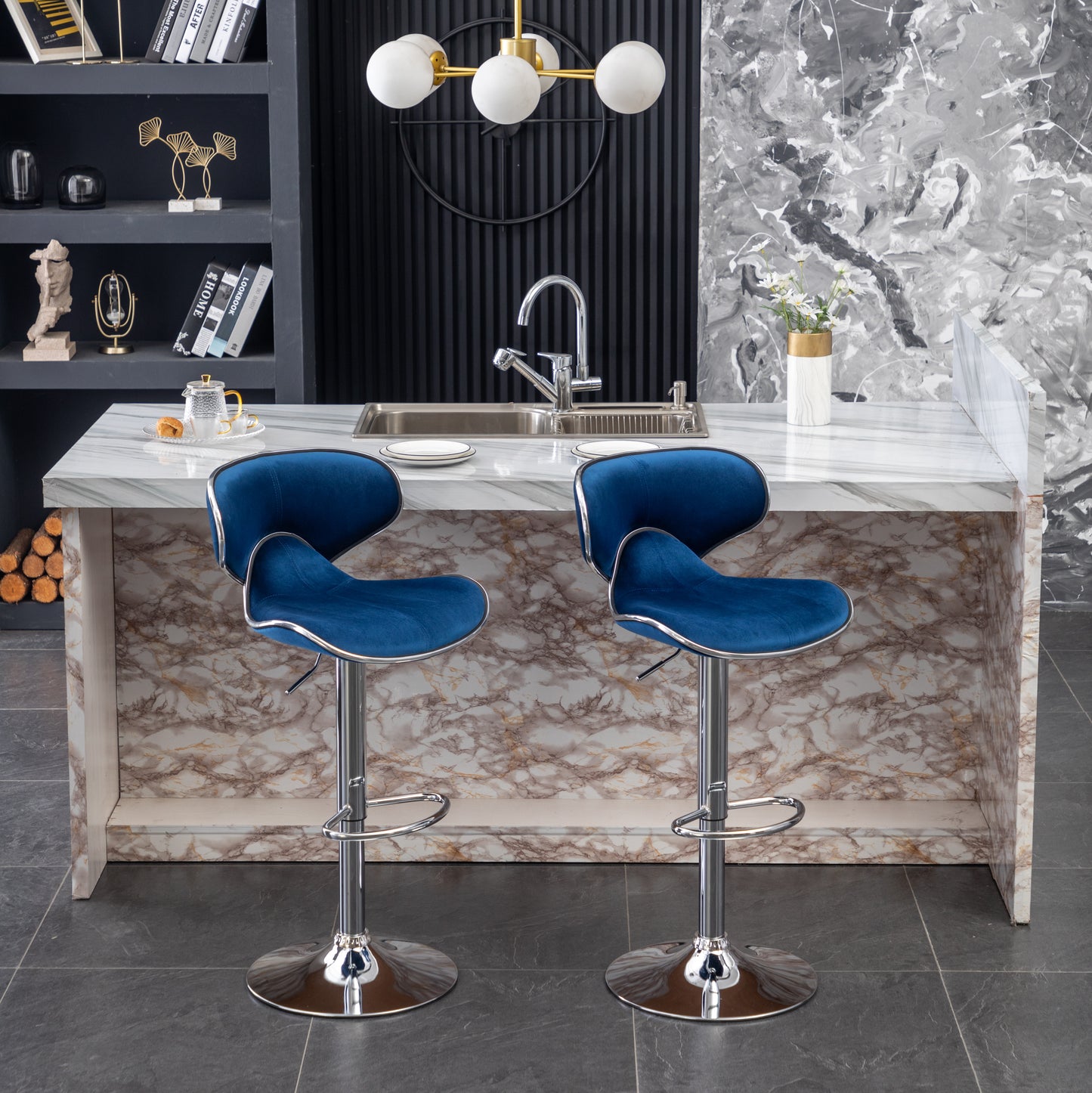 Two plush navy blue velvet bar stools with chrome bases and adjustable height for modern kitchens
