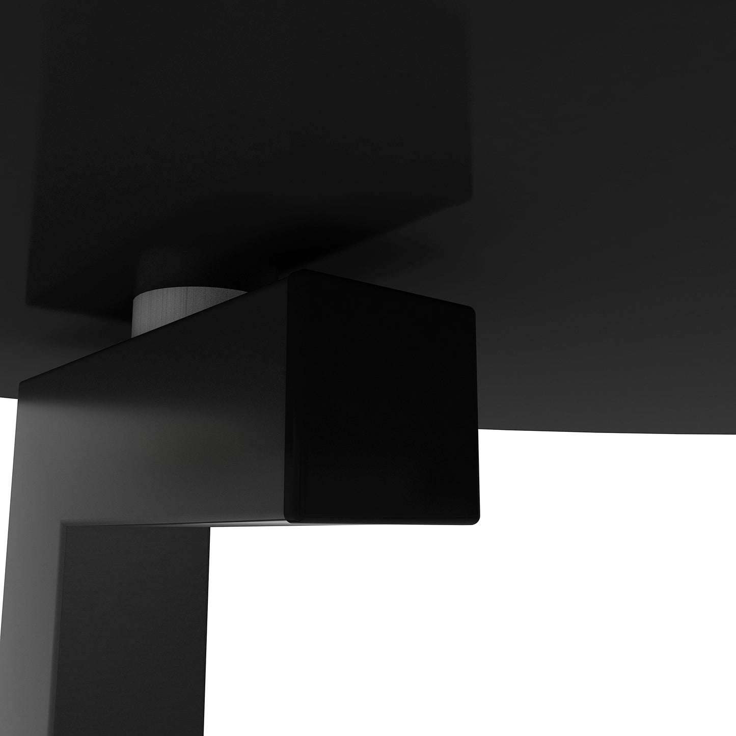 Closeup of a black modern table leg joint with metallic accent part of the furniture design