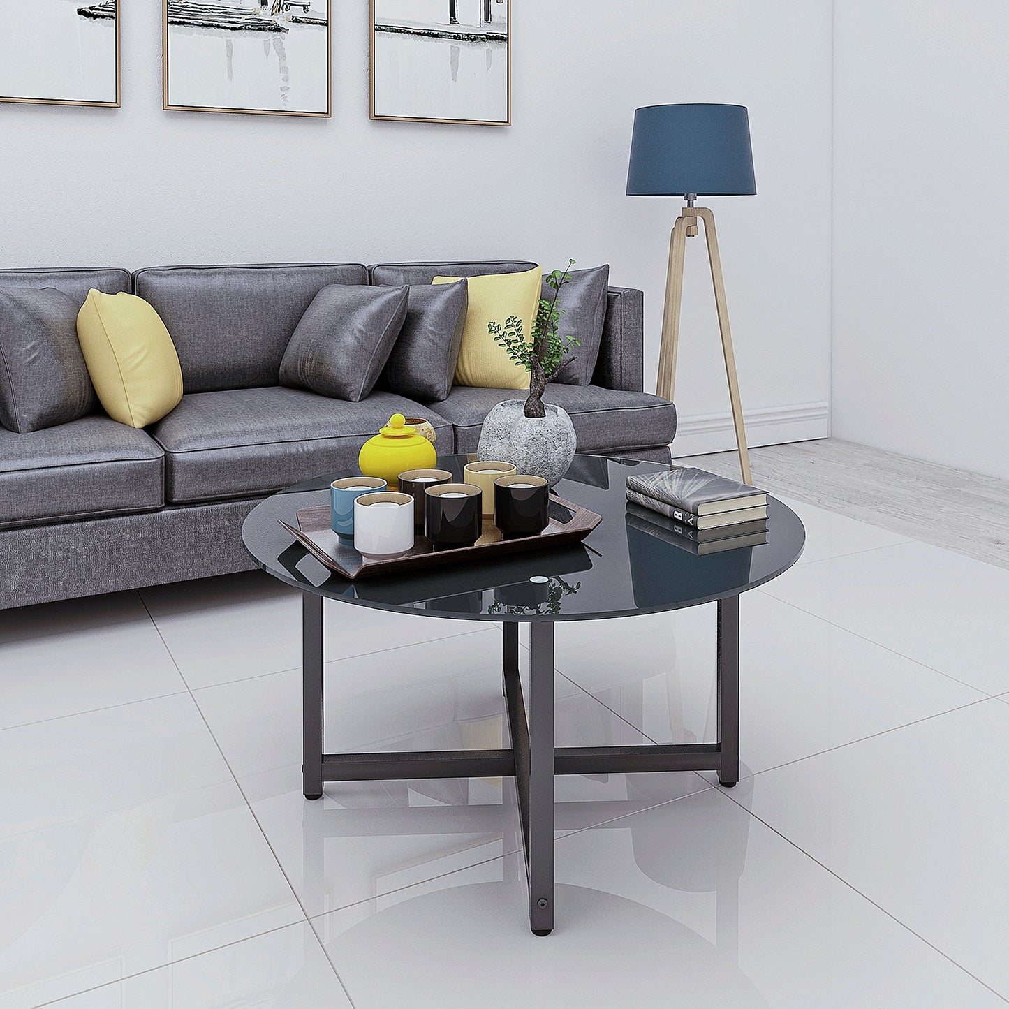 Dark grey round coffee table with metal legs and a wooden tray holding cups
