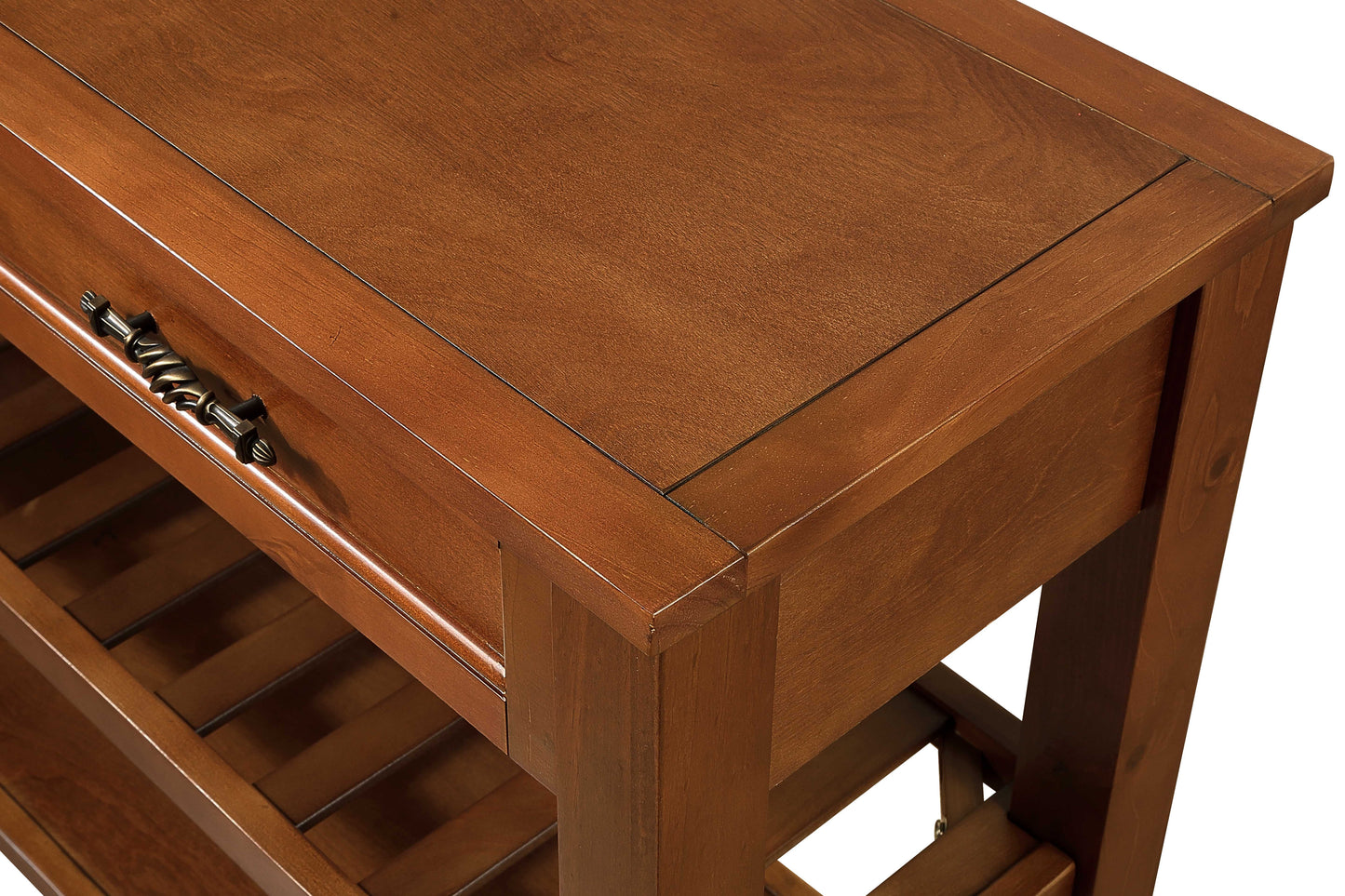 Rich cherry wood kitchen island with a single ornate drawer pull and slatted shelves for storage