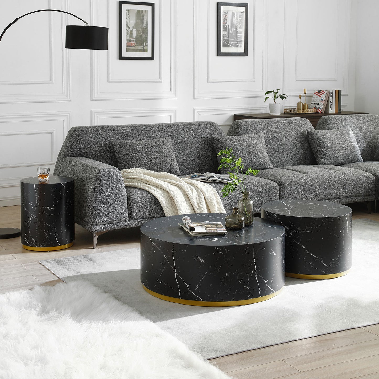 Round marble coffee table with a gold base ideal for modern living rooms