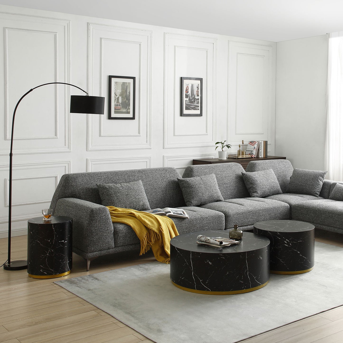 Gray sectional sofa with plush cushions and a bright yellow throw ideal for modern living rooms