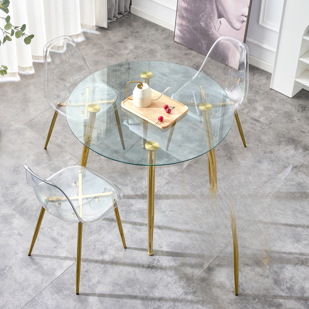 Clear acrylic dining chairs with gold legs