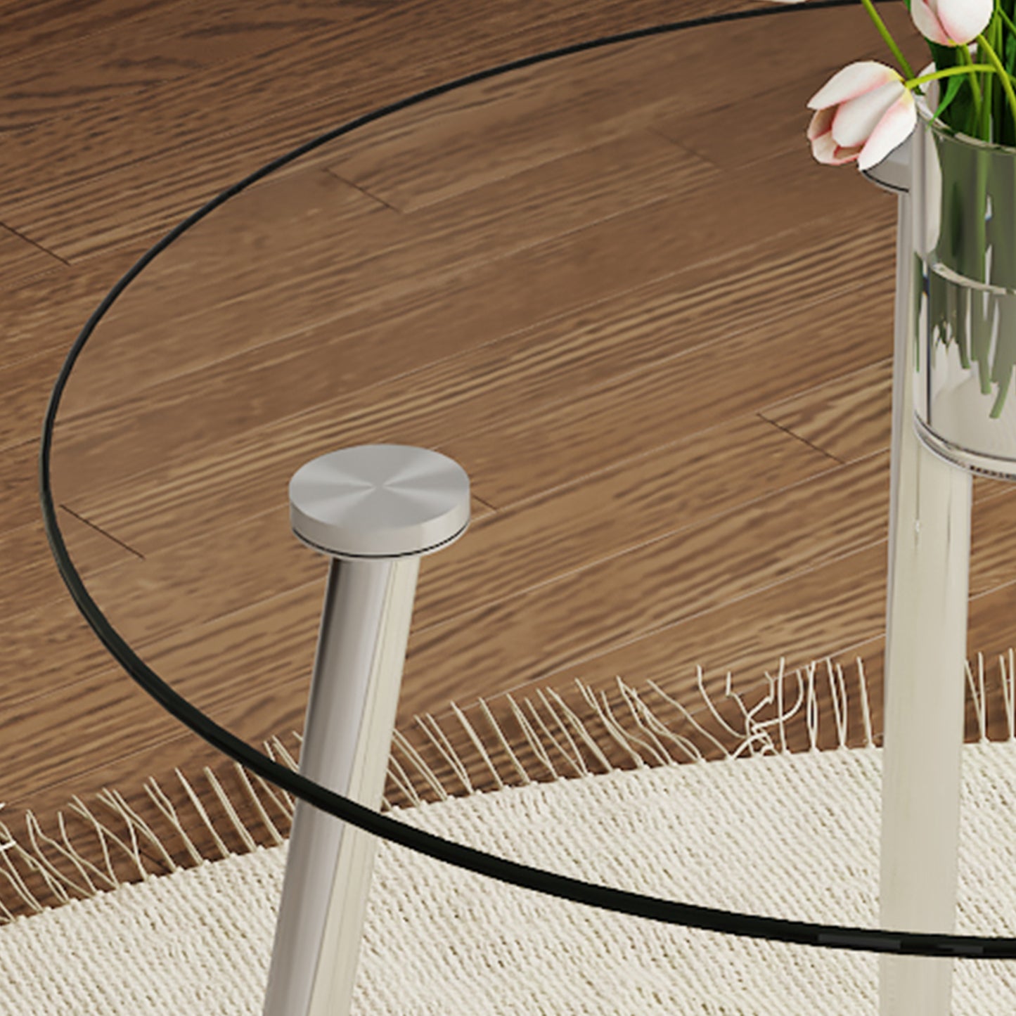 Glass top coffee table with brushed nickel legs on a beige rug