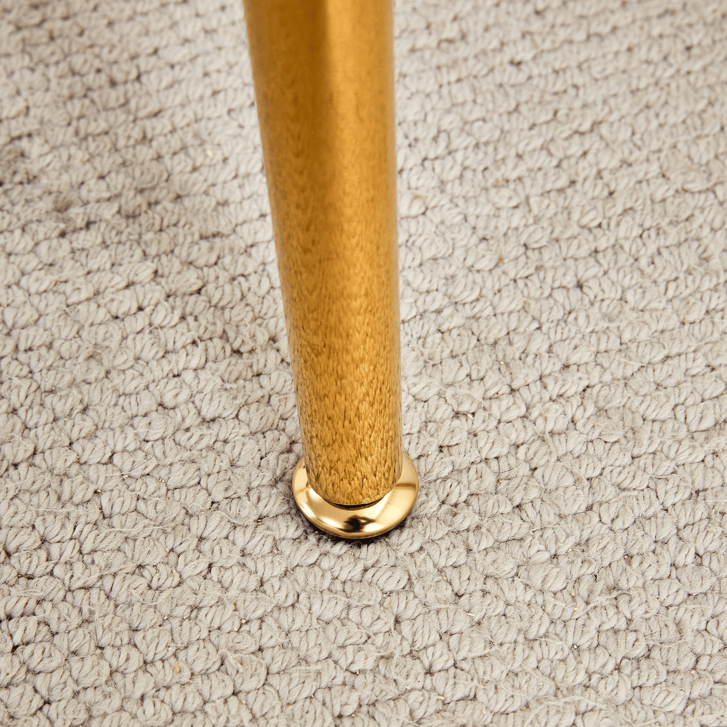 Golden metal furniture leg with polished finish