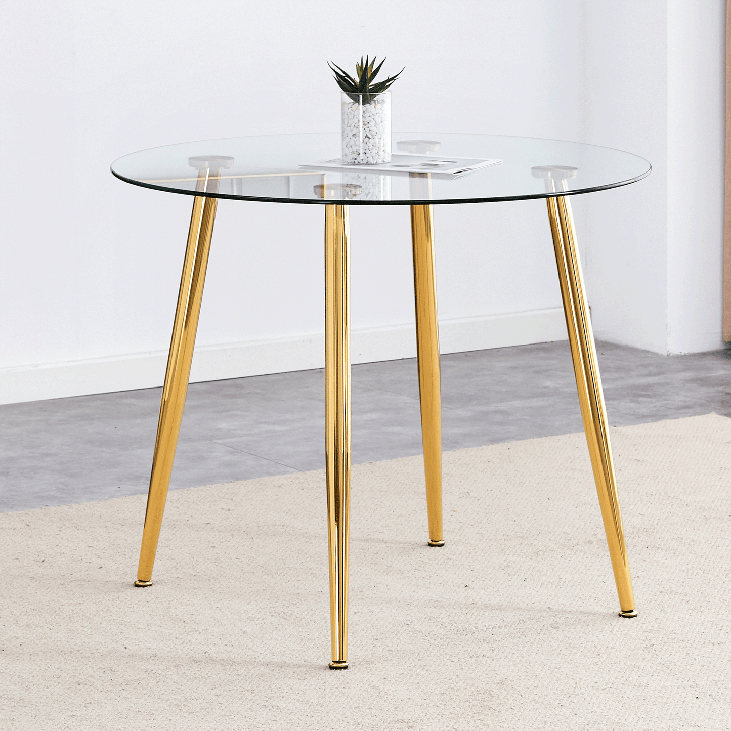Round glass dining table with gold legs