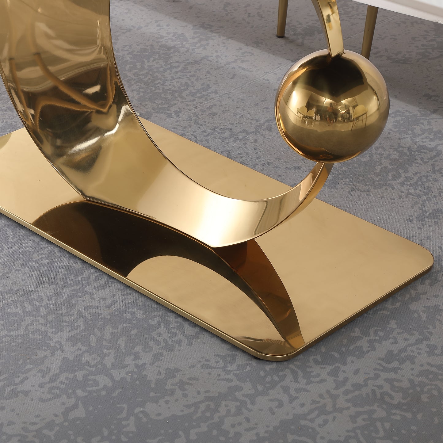 Gold abstract sculpture base with rounded sphere detail