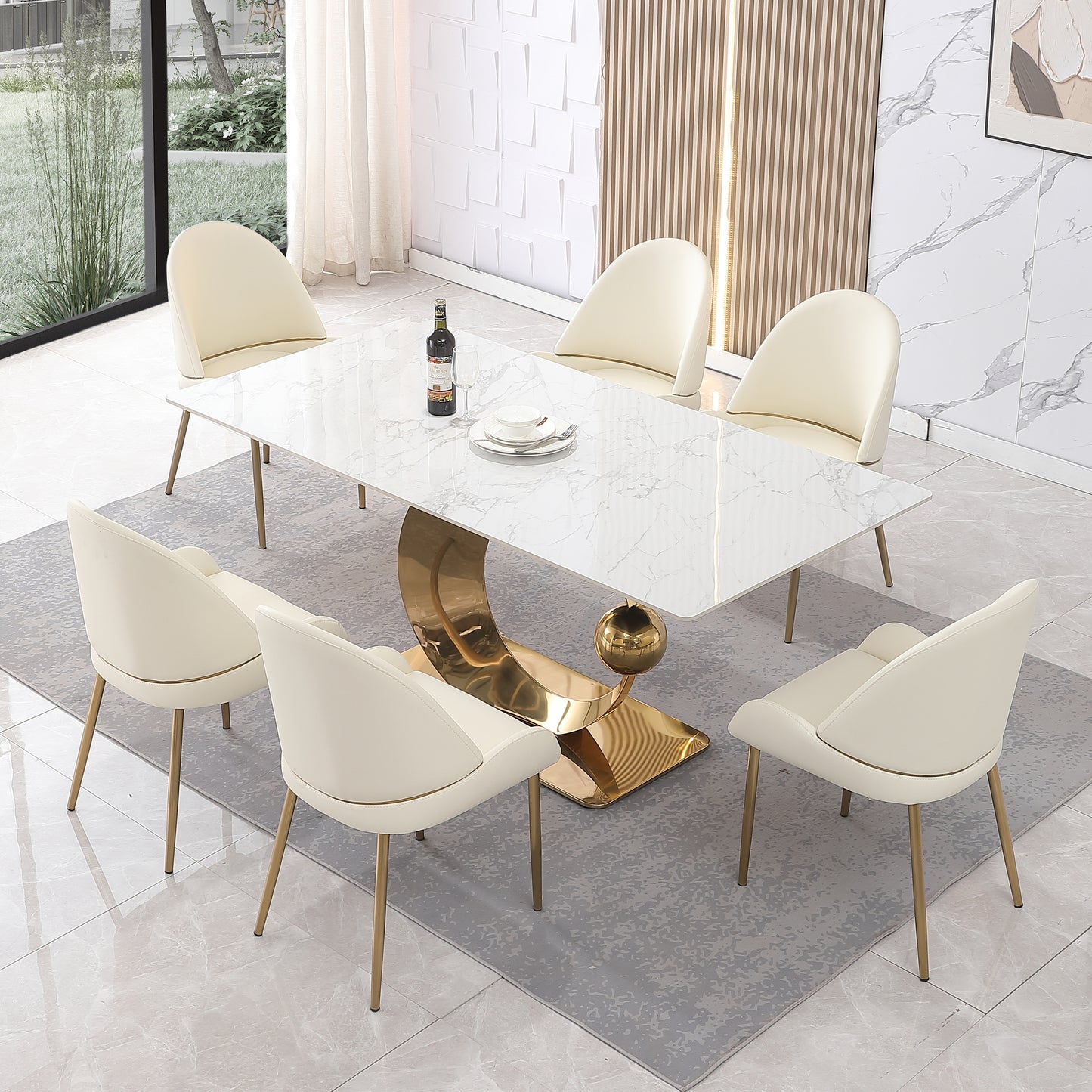 Elegant white marble dining table with curved gold pedestal base and six cream upholstered chairs