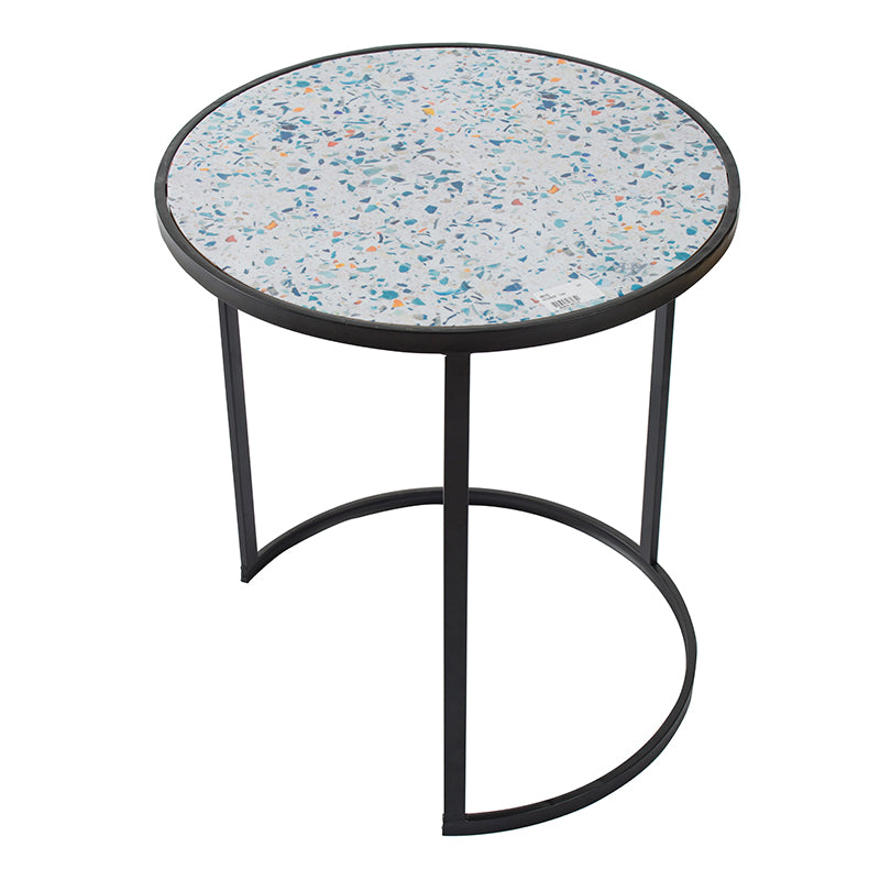 Round terrazzo side table with black metal legs and a multicolored speckled top