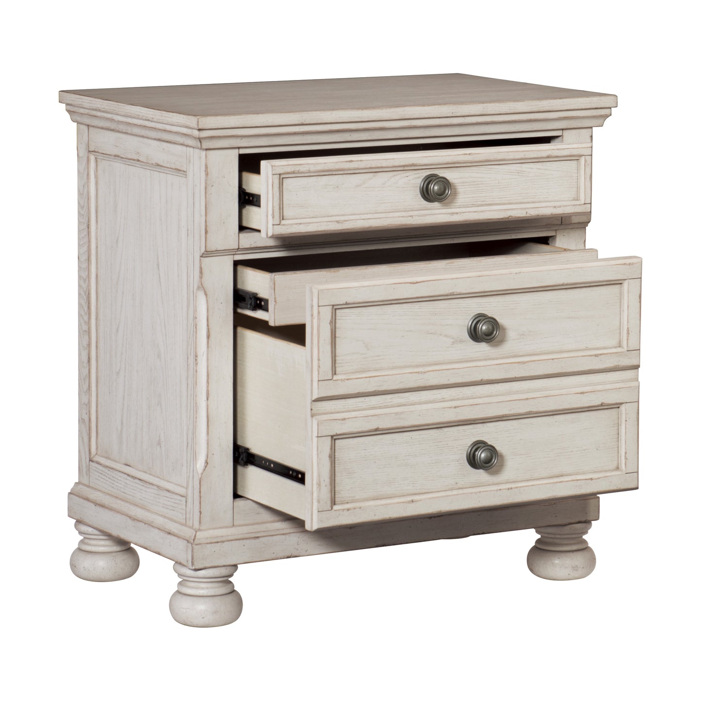 Whitewashed wood nightstand with three drawers and antique brass knobs