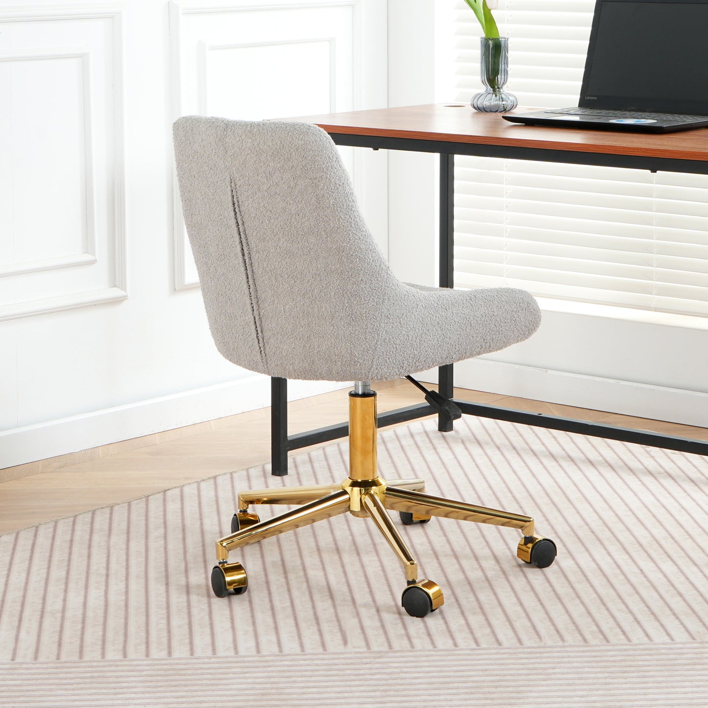 Light gray boucle fabric office chair with gold base and wheels