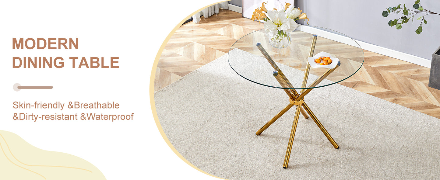 Round glass dining table with gold Xshaped base and floral centerpiece