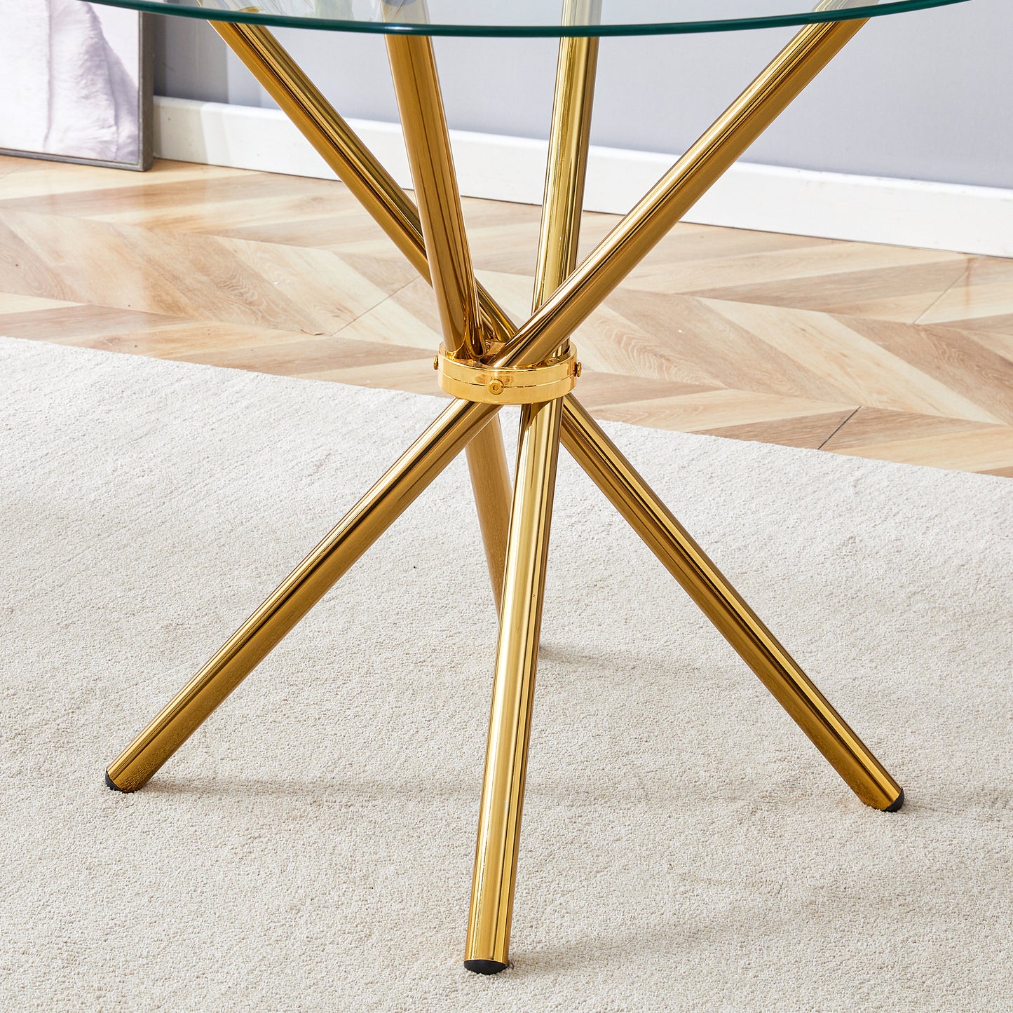 Gold metal spider base with glass tabletop