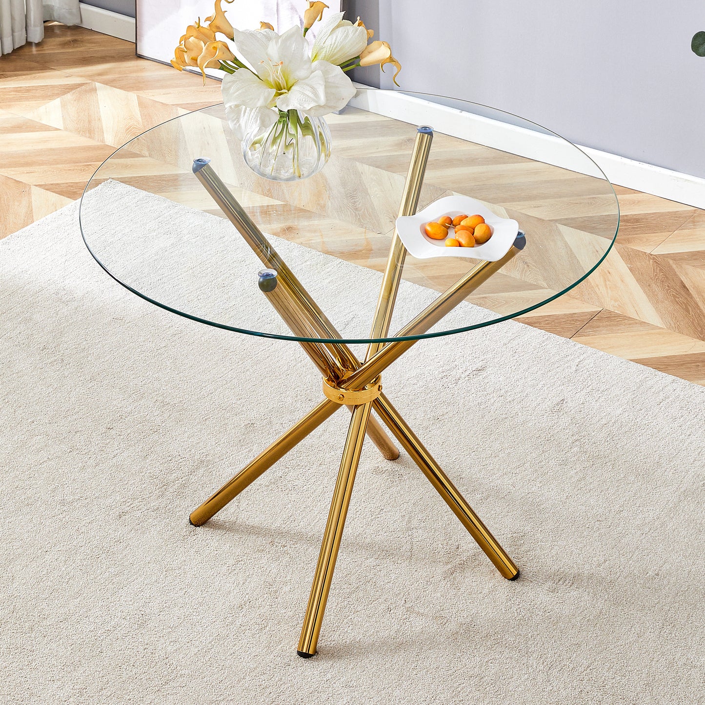 Round glass coffee table with gold starburst base