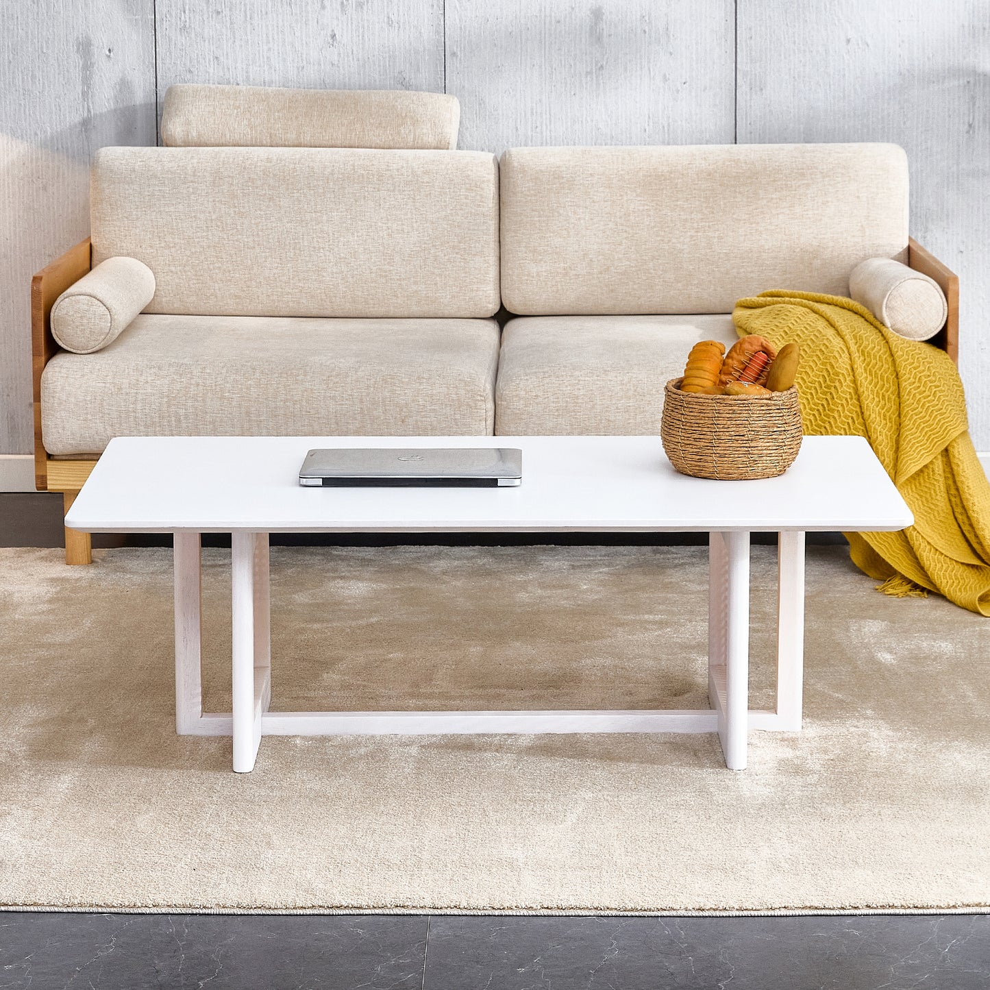 Minimalist white coffee table with modern wooden legs