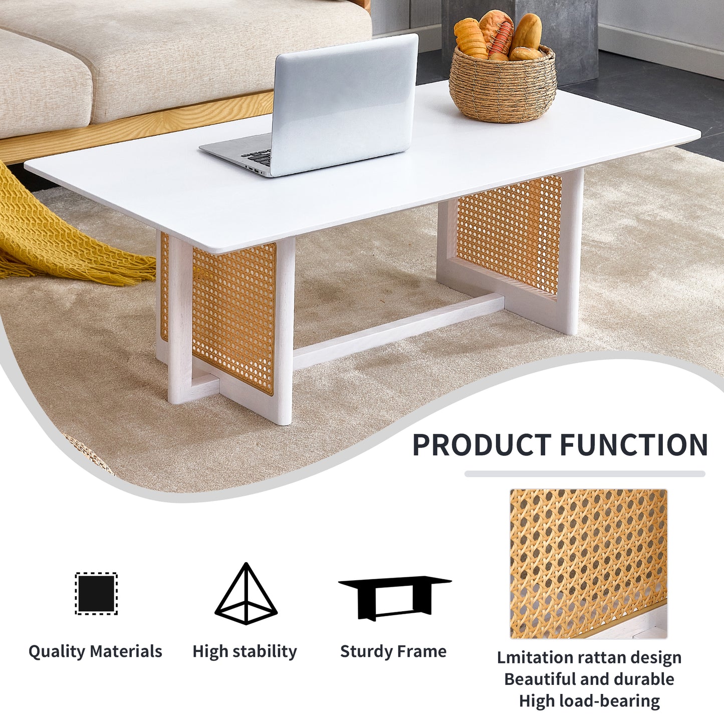 White coffee table with rattan accents and a laptop