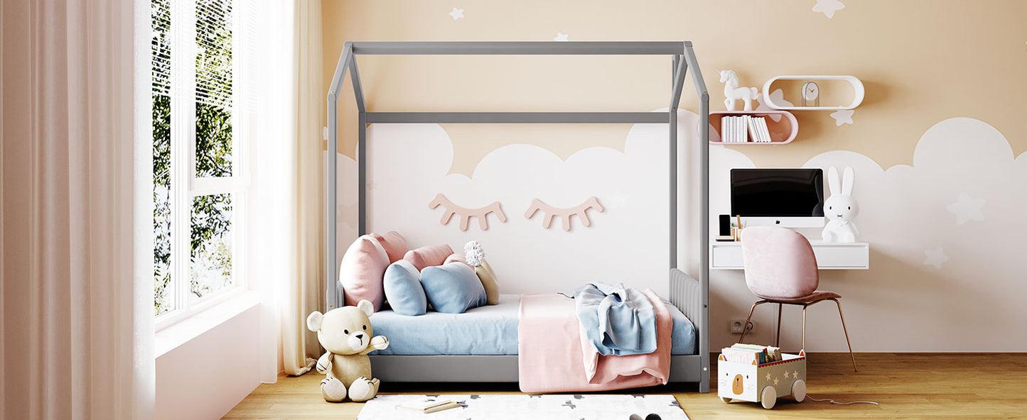 Gray wooden house bed frame for kids nursery with bedding and toys