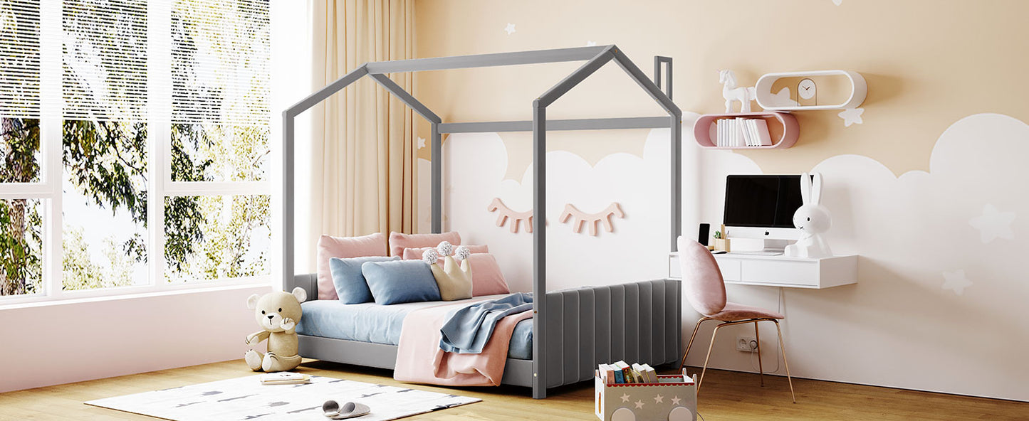 Gray wooden house bed frame with blue and pink bedding and pillows