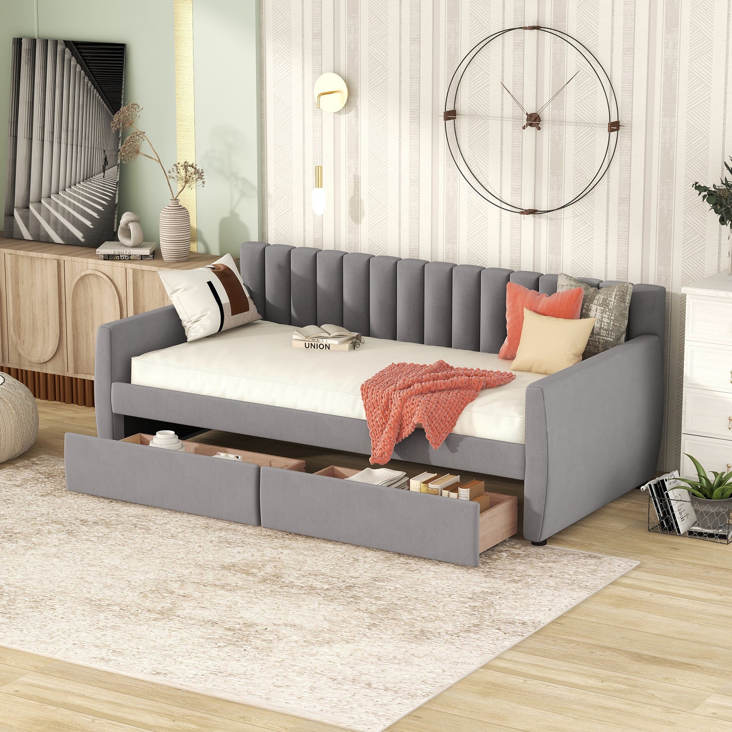 Grey upholstered daybed with two pullout drawers for storage