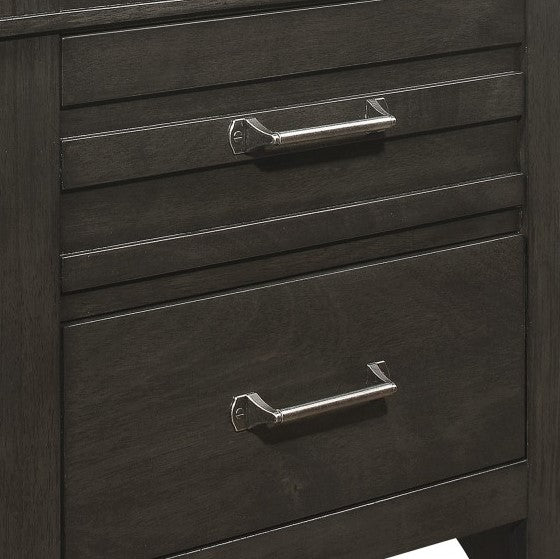 Closeup of dark grey wood dresser drawers with brushed nickel handles