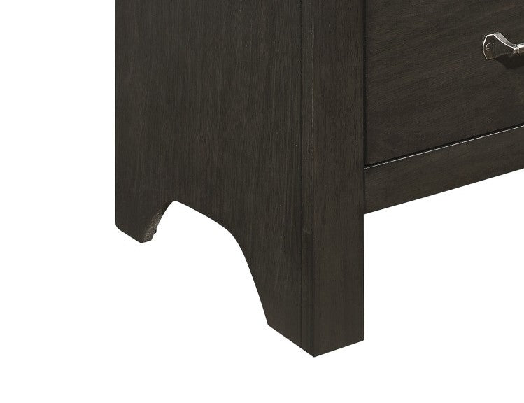 Dark wood nightstand corner with carved leg detail
