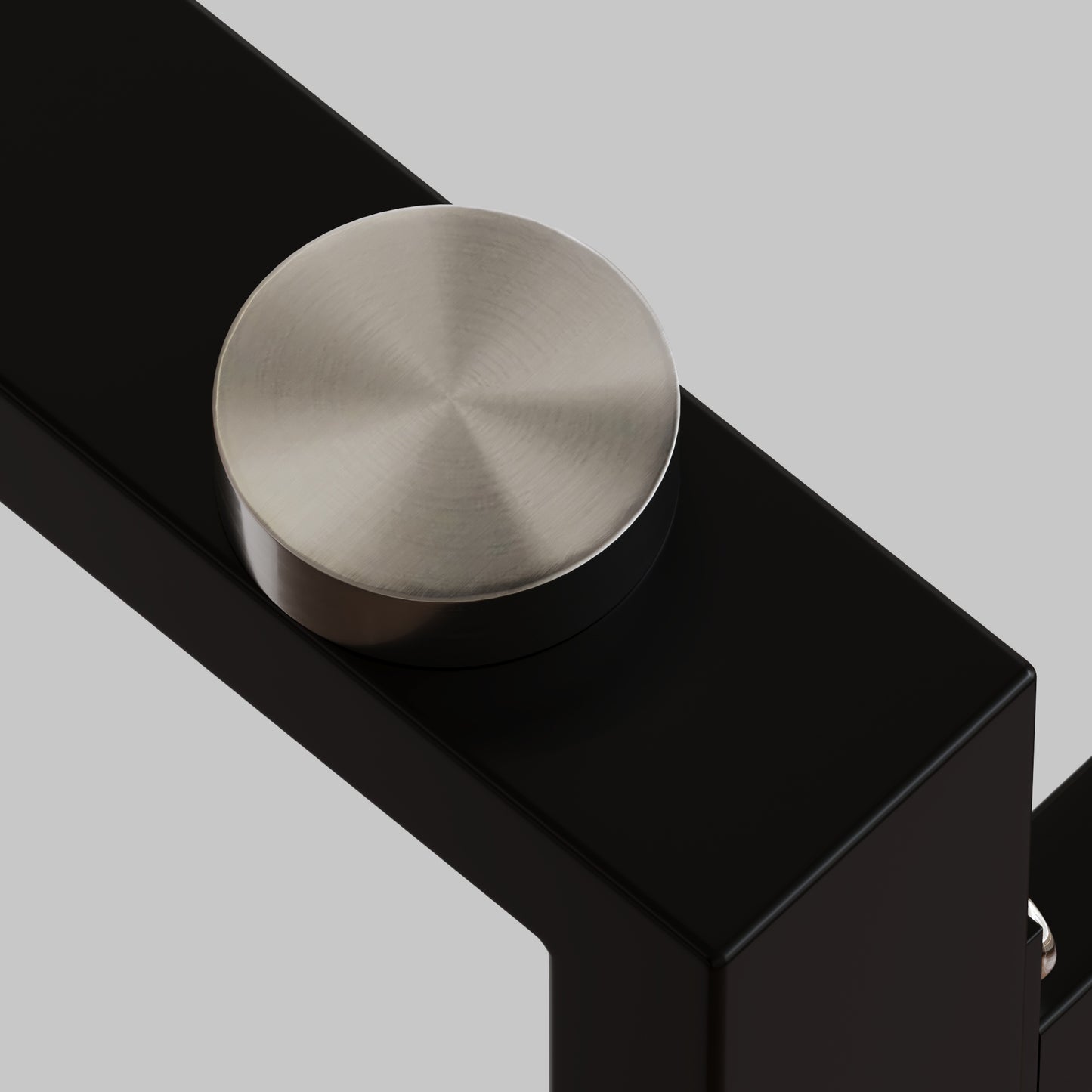 Satin nickel accent on matte black metal furniture leg