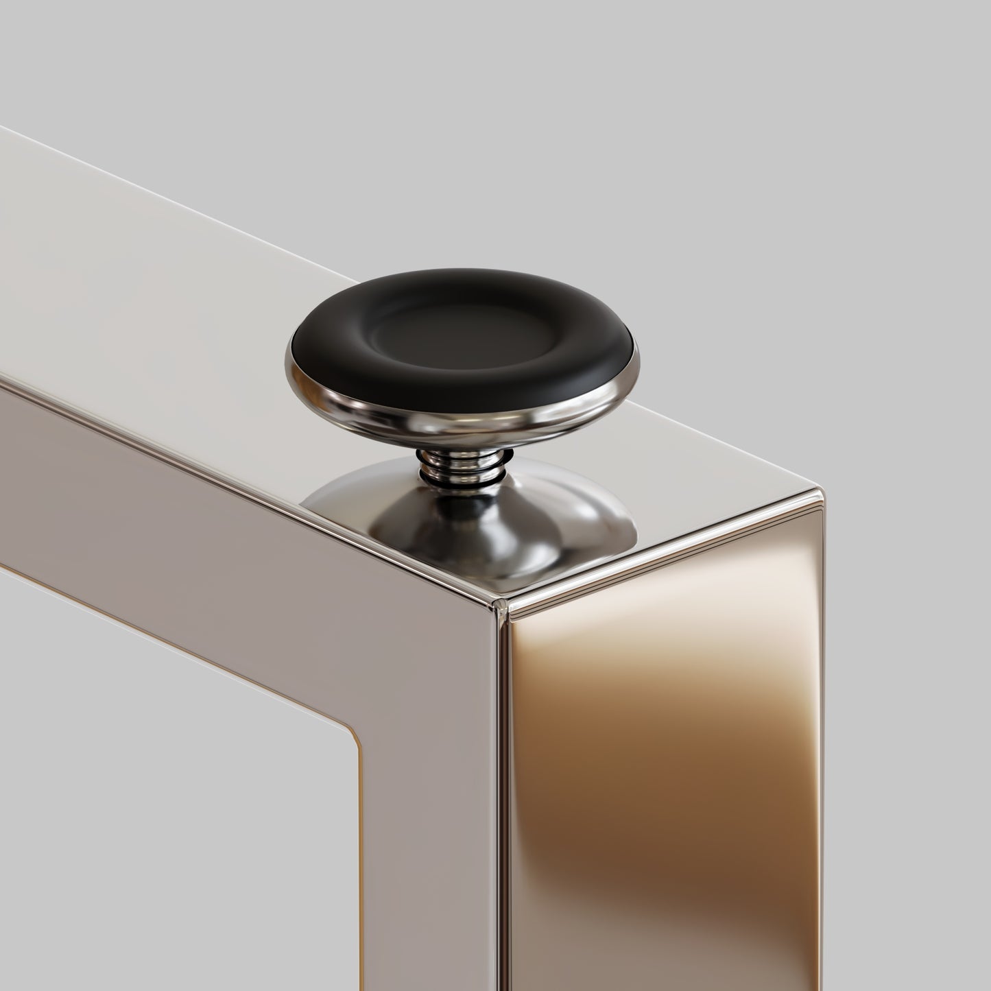 Black rubber adjustable foot on a polished chrome furniture leg